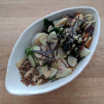 Grain bowl with vegetables, nori strips and dressing
