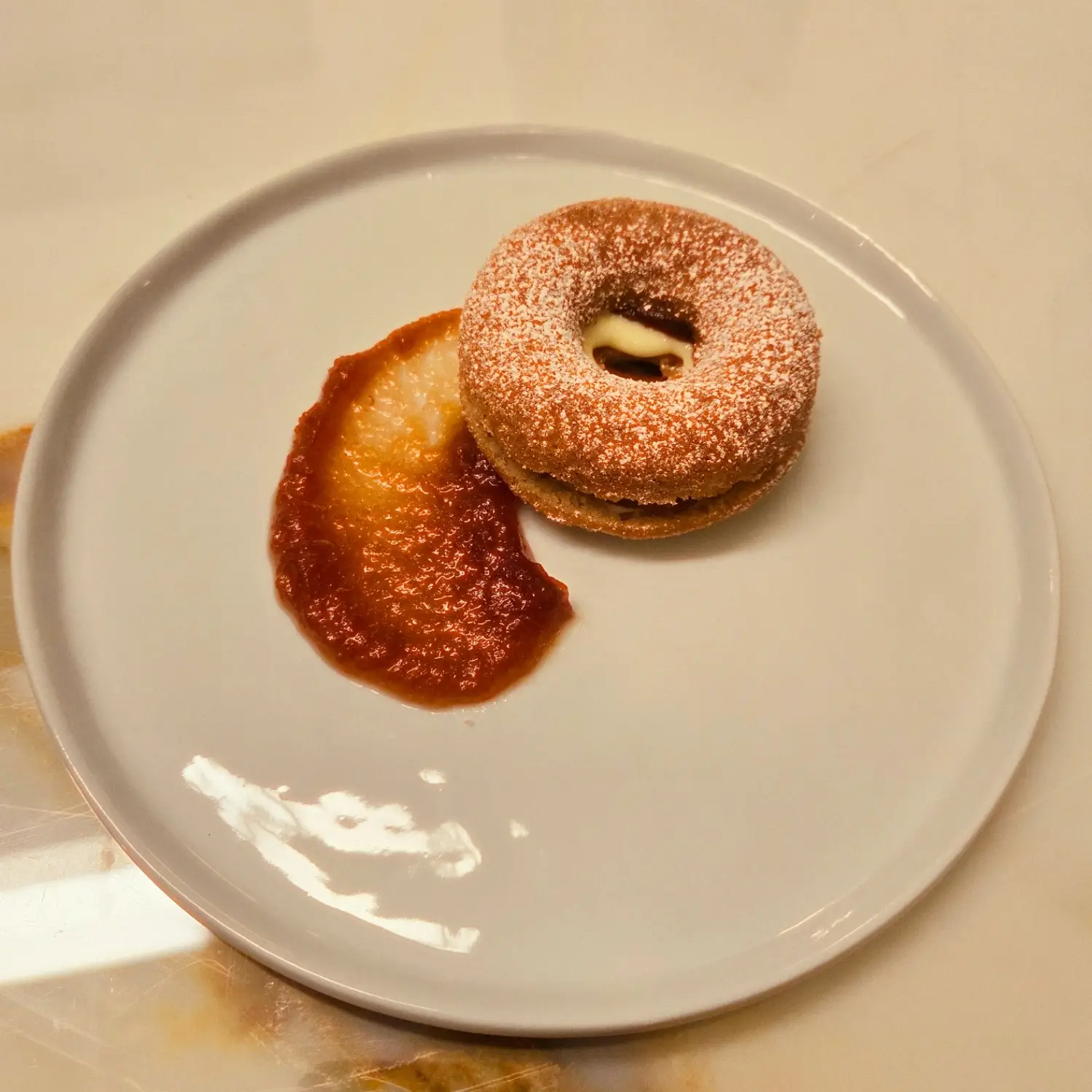 Photo of a apple cider donut, photo links to the Recipe Development & Consulting webpage.